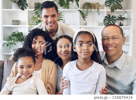 Portrait of family with kids, parents and grandparents on sofa with smile in happy home in Brazil. Happiness, generations of men and women with children, spending time together making fun memories. 138870414