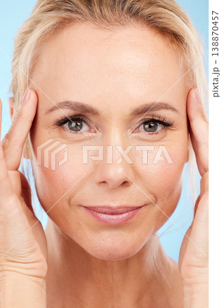 Portrait, senior woman and skincare with dermatology, cosmetics and against blue studio background. Face detox, mature female and lady with organic facial, salon treatment and grooming on backdrop Portrait, senior woman and skincare with dermatology, cosmetics and against blue studio background. Face detox, mature female and lady with organic facial, salon treatment and grooming on backdrop 138870457