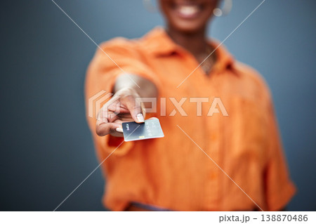 Black Woman, hand and payment on credit card is paying a bill in studio background for success. Finance, banking and girl with plastic for investment or budget or hand showing purchase method. Black Woman, hand and payment on credit card is paying a bill in studio background for success. Finance, banking and girl with plastic for investment or budget or hand showing purchase method. 138870486