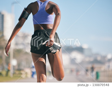 Stretching legs, fitness and back of a woman in the city for running, exercise and training for a marathon. Morning, outdoor warm up and an athlete ready to start a workout, cardio or sports 138870548