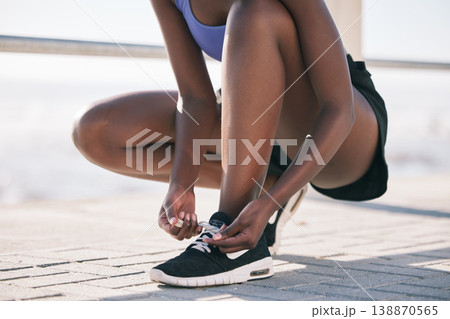Hands, city and runner tie shoes to start workout, training or exercise outdoor. Sports, fitness and athlete tying laces on sneakers to prepare for cardio, running and jog for body health or wellness Hands, city and runner tie shoes to start workout, training or exercise outdoor. Sports, fitness and athlete tying laces on sneakers to prepare for cardio, running and jog for body health or wellness 138870565