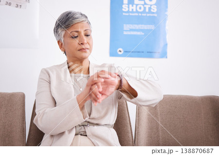 Watch, time and a senior woman waiting in a clinic for her healthcare appointment or medical checkup. Delay, impatient and a mature female patient sitting in the lobby of a hospital for consultation 138870687