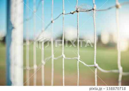 Empty, sports and goal post on soccer field for fitness training, exercise or workout outdoors. Football club, grass pitch background or closeup of blur net of game in competition or match contest Empty, sports and goal post on soccer field for fitness training, exercise or workout outdoors. Football club, grass pitch background or closeup of blur net of game in competition or match contest 138870718