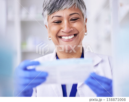 Happy, pharmacist or senior woman with medication, package and smile with treatment. Mature lady, female person or healthcare professional with happiness, medical or pharmacy with employee or reading Happy, pharmacist or senior woman with medication, package and smile with treatment. Mature lady, female person or healthcare professional with happiness, medical or pharmacy with employee or reading 138871008