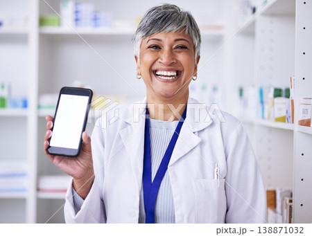 Portrait, mockup phone and a woman at a pharmacy for medical service, healthcare and showing an app. Smile, contact and a mature pharmacist with a blank mobile screen advertising medicine or advice Portrait, mockup phone and a woman at a pharmacy for medical service, healthcare and showing an app. Smile, contact and a mature pharmacist with a blank mobile screen advertising medicine or advice 138871032