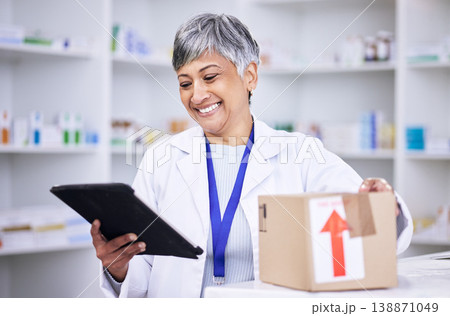 Happy woman, pharmacist and tablet in logistics with box for online order, delivery or shipping at pharmacy. Senior female person in medical healthcare for ecommerce or pharmaceuticals on technology 138871049