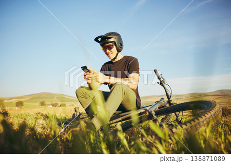 Phone, mountain bike and man outdoor in nature for extreme sports, training or workout. Smartphone, online communication and male person with bicycle for off road cycling, travel or adventure Phone, mountain bike and man outdoor in nature for extreme sports, training or workout. Smartphone, online communication and male person with bicycle for off road cycling, travel or adventure 138871089