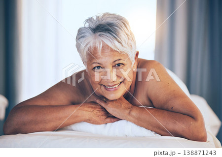 Happy senior woman, portrait and massage in relax for spa treatment, body care and physical therapy at resort. Calm elderly female person smile relaxing on salon bed for zen, stress relief or getaway 138871243