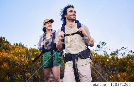 Hiking, travel and couple walking in nature for adventure, holiday and sightseeing journey on mountain. Fitness, dating and happy man and woman excited to explore, trekking and backpacking outdoors Hiking, travel and couple walking in nature for adventure, holiday and sightseeing journey on mountain. Fitness, dating and happy man and woman excited to explore, trekking and backpacking outdoors 138871260
