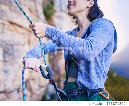Mountain, happy and woman with rope for rock climbing adventure, freedom and extreme sports in nature. Fitness, safety and female person with equipment or gear for training, activity and challenge Mountain, happy and woman with rope for rock climbing adventure, freedom and extreme sports in nature. Fitness, safety and female person with equipment or gear for training, activity and challenge 138871262