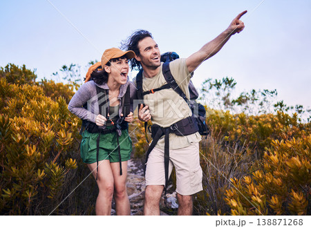 Hiking, pointing and excited couple in nature for adventure, holiday and journey on mountain. Travel, dating and man and woman walking with surprise and wow for view, trekking and backpacking outdoor Hiking, pointing and excited couple in nature for adventure, holiday and journey on mountain. Travel, dating and man and woman walking with surprise and wow for view, trekking and backpacking outdoor 138871268