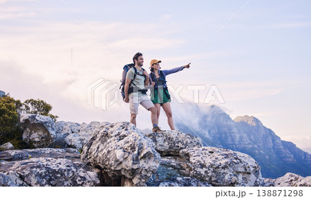 Mountain, trekking and view, man with woman on peak for adventure in nature, rock climbing and travel. Outdoor hiking, couple on cliff and relax in scenic clouds for natural journey, pointing at sky. Mountain, trekking and view, man with woman on peak for adventure in nature, rock climbing and travel. Outdoor hiking, couple on cliff and relax in scenic clouds for natural journey, pointing at sky. 138871298