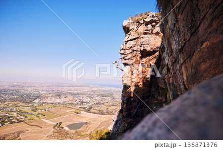 Sports, rock climbing and space with man on mountain for fitness, adventure and challenge. Fearless, workout and hiking with person on training cliff for travel, freedom and exercise mockup Sports, rock climbing and space with man on mountain for fitness, adventure and challenge. Fearless, workout and hiking with person on training cliff for travel, freedom and exercise mockup 138871376