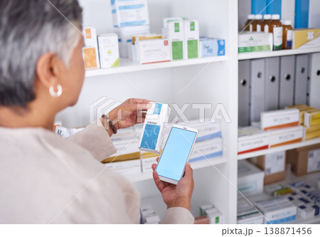 Woman, hands and phone mockup at pharmacy for medication, research or information on product in store. Female person looking at medicine with smartphone display for pharmaceutical search at clinic 138871456