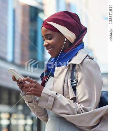 Phone, black woman travel or music in city on headphones for social media, motivation or mindset. Happy student girl on smartphone radio, listening or streaming audio podcast outdoor on urban street 138871614