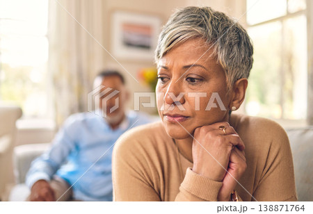 Divorce, senior woman and fight or sad in marriage in living room with partner or angry in home. Problem, upset and female person with conflict on sofa with couple or breakup and frustrated together. Divorce, senior woman and fight or sad in marriage in living room with partner or angry in home. Problem, upset and female person with conflict on sofa with couple or breakup and frustrated together. 138871764