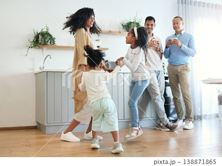 Happy, dance and jump with big family in kitchen for bonding, weekend and celebration fun. Wellness, music and playing with children and mother for dancing for happiness, affection and holiday 138871865