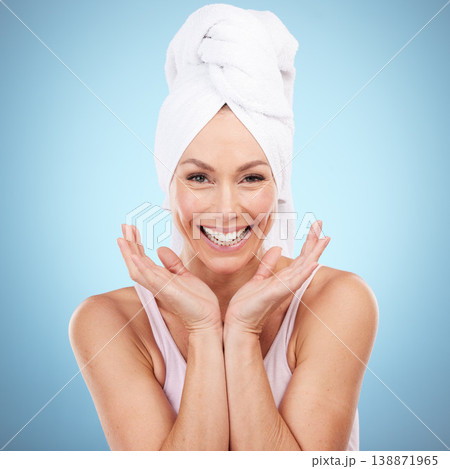 Portrait, skincare and woman with towel, smile and dermatology against blue studio background. Face detox. female and lady with washing, cleaning and hygiene with happiness, morning routine and relax Portrait, skincare and woman with towel, smile and dermatology against blue studio background. Face detox. female and lady with washing, cleaning and hygiene with happiness, morning routine and relax 138871965