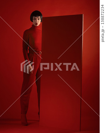Fashion, art and portrait of woman with red board, futuristic makeup and unique studio background. Future aesthetic, cyberpunk and creative beauty, body of model in dark luxury designer brand mockup. Fashion, art and portrait of woman with red board, futuristic makeup and unique studio background. Future aesthetic, cyberpunk and creative beauty, body of model in dark luxury designer brand mockup. 138872234