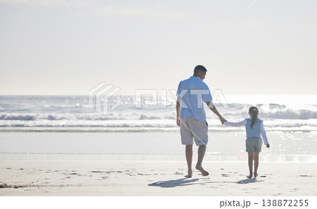 Beach, holding hands and father and kid walking for outdoor peace, freedom and fresh air on vacation holiday. Sea water, mockup ocean view and back of family, dad and young child bond, relax and care Beach, holding hands and father and kid walking for outdoor peace, freedom and fresh air on vacation holiday. Sea water, mockup ocean view and back of family, dad and young child bond, relax and care 138872255
