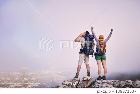 Mountains, hiking and man with woman on cliff for adventure in nature, landscape and travel. Outdoor trekking, couple on peak and relax in view of clouds on natural journey, celebration and arms up. Mountains, hiking and man with woman on cliff for adventure in nature, landscape and travel. Outdoor trekking, couple on peak and relax in view of clouds on natural journey, celebration and arms up. 138872337