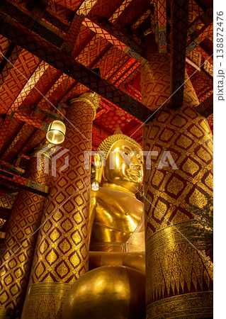 Golden the huge Buddha statue enshrined in Wat Phanan Choeng, called Wat Luang Pho Tho in Ayutthaya, Thailand. Golden the huge Buddha statue enshrined in Wat Phanan Choeng, called Wat Luang Pho Tho in Ayutthaya, Thailand. 138872476