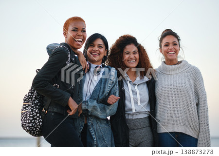 Bonding, laughing and portrait of women at the beach for travel, quality time and a reunion. Smile, laughing and diversity with friends on a group vacation by the sea to relax together in Miami Bonding, laughing and portrait of women at the beach for travel, quality time and a reunion. Smile, laughing and diversity with friends on a group vacation by the sea to relax together in Miami 138873278