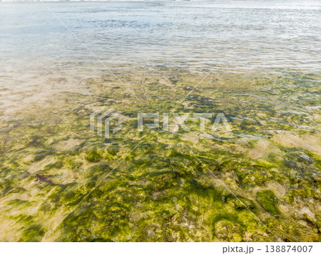 The beautiful aerial view of the morning on the beach with blue sea water in Kaur, Bengkulu, Indonesia The beautiful aerial view of the morning on the beach with blue sea water in Kaur, Bengkulu, Indonesia 138874007