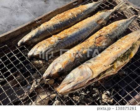 the process of roasting juicy and spiced fresh mackerel on a grill, mackerel on coals on a grill recipe the process of roasting juicy and spiced fresh mackerel on a grill, mackerel on coals on a grill recipe 138875261