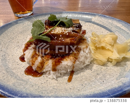 a delicious juicy dish of rice with eel in a restaurant on a beautiful plate 138875338