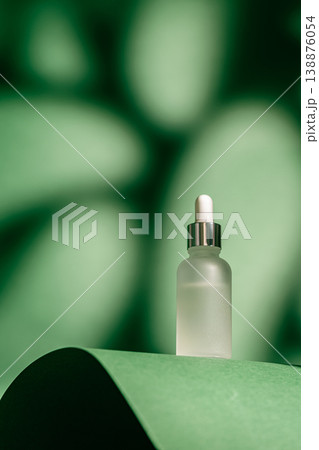 A frosted dropper bottle of facial serum 138876054