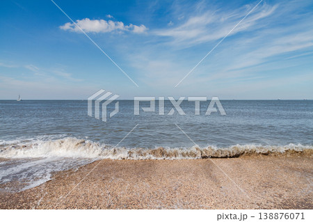Sea waves on sandy beach in The Hague Netherlands Sea waves on sandy beach in The Hague Netherlands 138876071