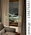 Cozy hotel room interior with a night city view through the window, Iceland. 138876883