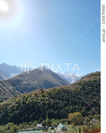 Mountain road overlooking Mayli glacier in Karmadon Gorge, North Ossetia, Russia. Scenic route with dramatic views of ice, rock and high-altitude landscape Mountain road overlooking Mayli glacier in Karmadon Gorge, North Ossetia, Russia. Scenic route with dramatic views of ice, rock and high-altitude landscape 138876980