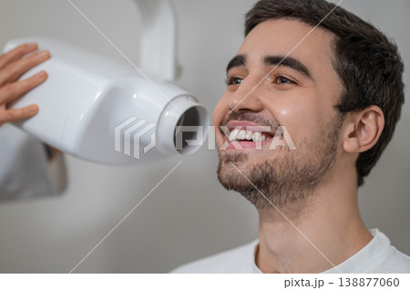 Close up of patient receiving dental x-ray scan Close up of patient receiving dental x-ray scan 138877060