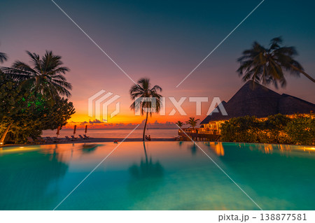 Stunning sunset infinity pool palm trees silhouette vibrant ocean view luxury summer vacation leisure landscape paradise travel destination breathtaking wallpaper 138877581