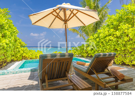 Breathtaking private wooden deck terrace sunbeds umbrella lush tropical garden ocean shore summer luxury vacation honeymoon getaway paradise travel wallpaper 138877584