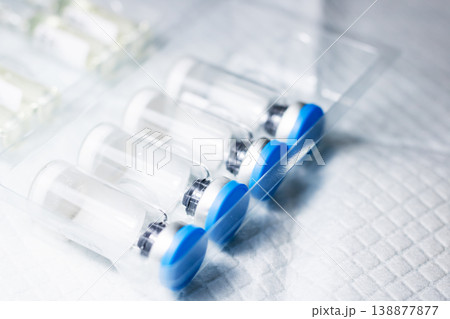 Clinically prepared syringes arranged in sterile setup for vaccine administration Clinically prepared syringes arranged in sterile setup for vaccine administration 138877877