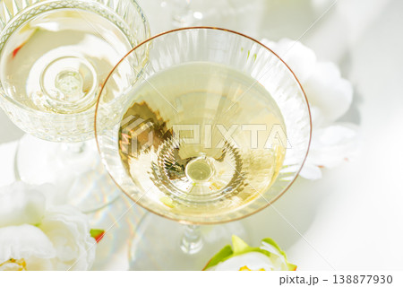 Champagne Glasses with White Peonies. Birthday or Wedding Celebration Arrangement 138877930