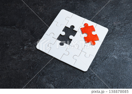 Missing red piece of a white puzzle. Missing red piece of a white puzzle. 138878085