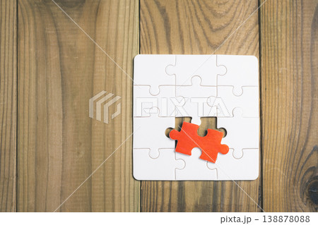 A puzzle piece is missing from a puzzle A puzzle piece is missing from a puzzle 138878088