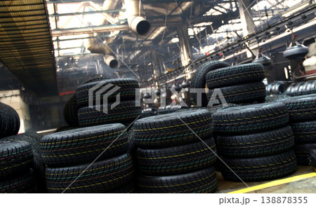 Tires production plant site. New cars tires stacking up on the workshop floor 138878355
