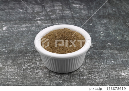 Freshly ground organic black pepper in rustic bowl over wooden surface. Healthy food seasoning Freshly ground organic black pepper in rustic bowl over wooden surface. Healthy food seasoning 138878619