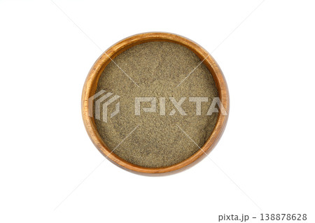 Ground black pepper spice in a wooden bowl isolated on white background. Top view, close-up 138878628