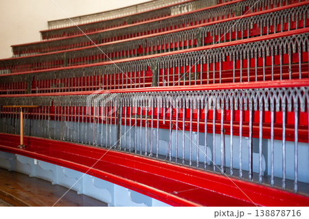 Historic auditorium interior, red benches, wooden table, vintage architecture, empty hall Historic auditorium interior, red benches, wooden table, vintage architecture, empty hall 138878716
