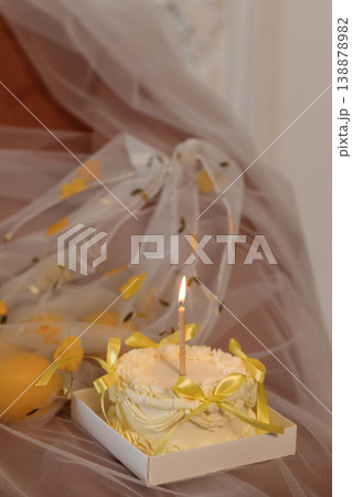 Decorative Food Presentation Featuring Yellow Dessert Beside Citrus And Sheer Fabric Drapery Decorative Food Presentation Featuring Yellow Dessert Beside Citrus And Sheer Fabric Drapery 138878982