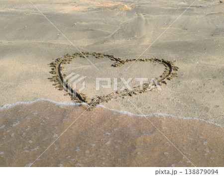 Heart drawn on the beach sand Heart drawn on the beach sand 138879094