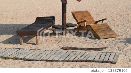 Wooden chaise lounge on the beach Wooden chaise lounge on the beach 138879105