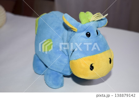 Stitched soft toy fabric on a white background. Animal toy. Stitched soft toy fabric on a white background. Animal toy. 138879142