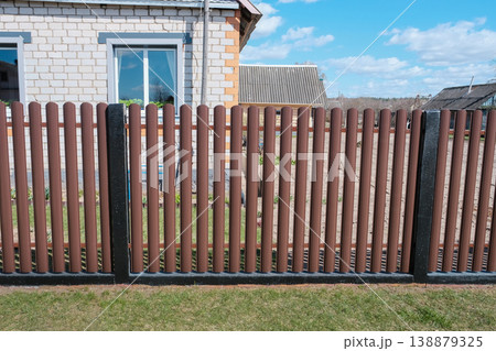 Modern brown metal euro fence panels home garden w section palisade picket with vertical slats and black posts 138879325